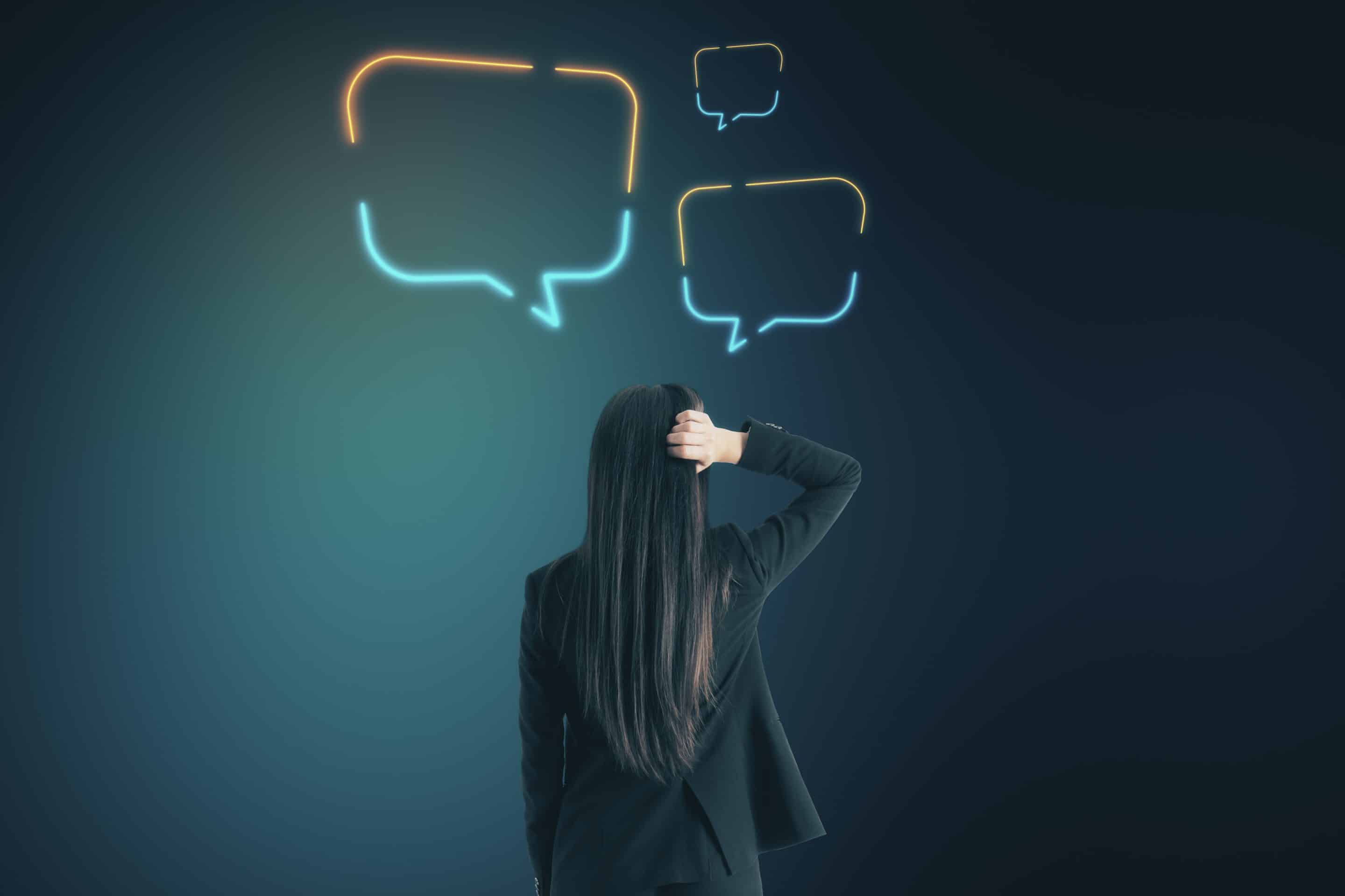 Businesswoman thinking with speech balloons over head