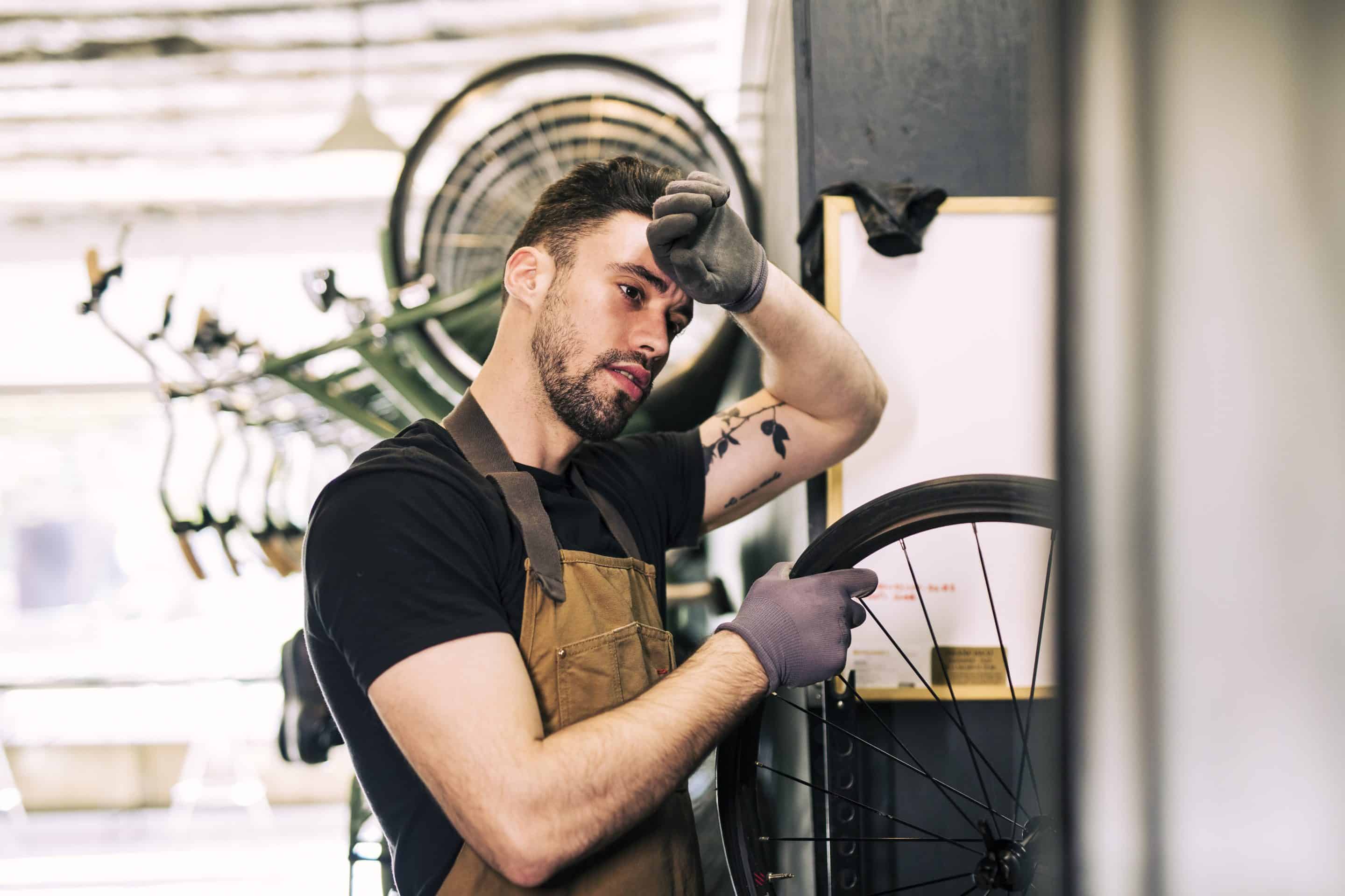 mechanic-repairing-bicycle